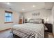 Cozy bedroom features a large window, striped bedding, and accent decor for a comfortable and inviting space at 1230 S Emerson St Dr, Denver, CO 80210