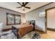 Cozy bedroom featuring a ceiling fan, natural light, and wood floors at 1230 S Emerson St Dr, Denver, CO 80210