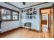 Bedroom with hardwood floors, record player, and an eclectic display of album covers at 1230 S Emerson St Dr, Denver, CO 80210
