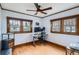 Bright office space with hardwood floors, large windows, and an ergonomic desk setup at 1230 S Emerson St Dr, Denver, CO 80210