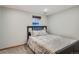 Well lit bedroom features a large window and comfortable bedding, creating a peaceful and inviting space at 1230 S Emerson St Dr, Denver, CO 80210
