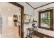Eat-in kitchen with a bar and stainless steel appliances at 1230 S Emerson St Dr, Denver, CO 80210