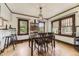 Well-lit dining room with hardwood floors and stylish pendant lighting at 1230 S Emerson St Dr, Denver, CO 80210