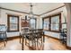 Bright dining room with hardwood floors, classic trim, and a stylish chandelier for Gathering gatherings at 1230 S Emerson St Dr, Denver, CO 80210
