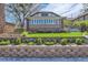 Inviting brick home with a lovely garden and sunroom, set on a beautifully landscaped lot at 1230 S Emerson St Dr, Denver, CO 80210