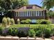 Charming brick home with well-maintained lawn, landscaping, and For Sale sign at 1230 S Emerson St Dr, Denver, CO 80210