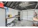 Clean, organized garage interior with workbench, storage cabinets, and modern tools at 1230 S Emerson St Dr, Denver, CO 80210