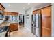 Well-lit kitchen with granite countertops, stainless steel appliances, and ample cabinet space at 1230 S Emerson St Dr, Denver, CO 80210