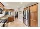 Bright kitchen featuring stainless steel appliances and tiled floors at 1230 S Emerson St Dr, Denver, CO 80210