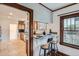 Bright kitchen featuring granite counters, stainless appliances, and a cozy breakfast bar with seating for two at 1230 S Emerson St Dr, Denver, CO 80210