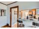 Partial view of modern kitchen with granite countertops, stylish bar seating, and stainless-steel appliances at 1230 S Emerson St Dr, Denver, CO 80210