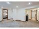 Spacious living room featuring plush carpet, recessed lighting, and an open layout at 1230 S Emerson St Dr, Denver, CO 80210