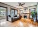 Inviting living room with a fireplace, hardwood floors, and comfortable seating, perfect for relaxation at 1230 S Emerson St Dr, Denver, CO 80210