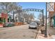 A street view of South Pearl Street, with shops, restaurants, and parked cars under the South Pearl Street sign at 1230 S Emerson St Dr, Denver, CO 80210