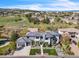 An aerial view of a modern home, showcasing its landscaping, a large yard, and its place in a quiet suburban neighborhood at 10095 S Shadow Hill Dr, Lone Tree, CO 80124