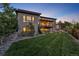 Exterior view of a home showcasing its backyard and covered deck with outdoor seating at 10095 S Shadow Hill Dr, Lone Tree, CO 80124
