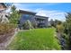 Expansive backyard with lush green lawn and mature landscaping at 10095 S Shadow Hill Dr, Lone Tree, CO 80124