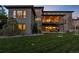 Large, well-maintained backyard with a covered patio and multi-level home design at 10095 S Shadow Hill Dr, Lone Tree, CO 80124