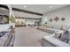 Spacious basement featuring a built-in bar, entertainment area, and comfortable seating at 10095 S Shadow Hill Dr, Lone Tree, CO 80124