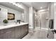 Modern bathroom with a glass-enclosed shower, dual vanity, and sleek finishes at 10095 S Shadow Hill Dr, Lone Tree, CO 80124