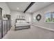 Spacious bedroom featuring a large bed, decorative wreath, and ample natural light at 10095 S Shadow Hill Dr, Lone Tree, CO 80124