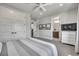 Bright bedroom with an ensuite bathroom and laundry room at 10095 S Shadow Hill Dr, Lone Tree, CO 80124
