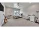 Bright bedroom with a ceiling fan, decorative wall art, and a cozy writing desk at 10095 S Shadow Hill Dr, Lone Tree, CO 80124