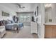 Neutral bedroom with a sports theme, dresser and attached bathroom at 10095 S Shadow Hill Dr, Lone Tree, CO 80124
