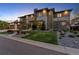 Exterior view of a home with stone accents, manicured landscaping, and a three car garage at 10095 S Shadow Hill Dr, Lone Tree, CO 80124
