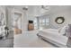 Airy bedroom featuring large windows with scenic views and a ceiling fan at 10095 S Shadow Hill Dr, Lone Tree, CO 80124