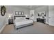Calm main bedroom with neutral tones, plush carpet, and ensuite bathroom access at 10095 S Shadow Hill Dr, Lone Tree, CO 80124