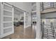 Spacious foyer and office entrance with barn doors, high ceilings, and natural light at 10095 S Shadow Hill Dr, Lone Tree, CO 80124