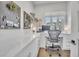 Bright office space with a long counter, built-in drawers, and a large window for natural light at 10095 S Shadow Hill Dr, Lone Tree, CO 80124