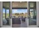 View of covered outdoor patio with comfortable seating and scenic views at 10095 S Shadow Hill Dr, Lone Tree, CO 80124