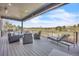 Spacious covered patio featuring lounge seating and beautiful backyard views at 10095 S Shadow Hill Dr, Lone Tree, CO 80124