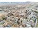 Panoramic aerial view of a neighborhood nestled in a valley with majestic mountains in the backdrop at 1513 S Beech St, Lakewood, CO 80228