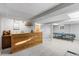 Entertaining basement area with a wet bar and a ping pong table at 1513 S Beech St, Lakewood, CO 80228