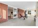 Bright bonus room featuring red brick and sliding doors leading to the outside at 1513 S Beech St, Lakewood, CO 80228