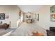 Open-concept dining room features a modern light fixture and a dining table with four chairs at 1513 S Beech St, Lakewood, CO 80228