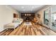 Cozy living room with a fireplace, hardwood floors, and natural light at 1513 S Beech St, Lakewood, CO 80228