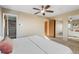 Main bedroom with neutral paint, closet, ensuite bathroom, and natural light at 1513 S Beech St, Lakewood, CO 80228