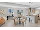 Contemporary dining area flowing to the kitchen with modern lighting at 1625 King St # 4, Denver, CO 80204