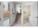 Inviting entryway with tile flooring, stairs to the second level, and powder room at 1625 King St # 4, Denver, CO 80204