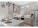 Bright modern kitchen with stainless steel appliances and white countertops at 1625 King St # 4, Denver, CO 80204