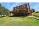 A sprawling backyard featuring a spacious deck and lush green lawn at 6279 Cheyenne Ct, Parker, CO 80134