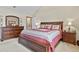 Traditional bedroom is furnished with an elegant queen bed and decorative accent pieces at 6279 Cheyenne Ct, Parker, CO 80134