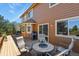 Well-maintained outdoor deck area with seating, grill, and views of the surrounding landscape at 6279 Cheyenne Ct, Parker, CO 80134