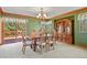 Elegant dining room featuring a wooden table, chairs, and a large cabinet at 6279 Cheyenne Ct, Parker, CO 80134
