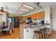 Spacious kitchen featuring a breakfast bar with seating, wooden cabinets and stainless steel appliances at 6279 Cheyenne Ct, Parker, CO 80134