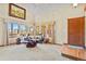 Open-concept living room with vaulted ceilings, large windows, and comfortable seating at 6279 Cheyenne Ct, Parker, CO 80134